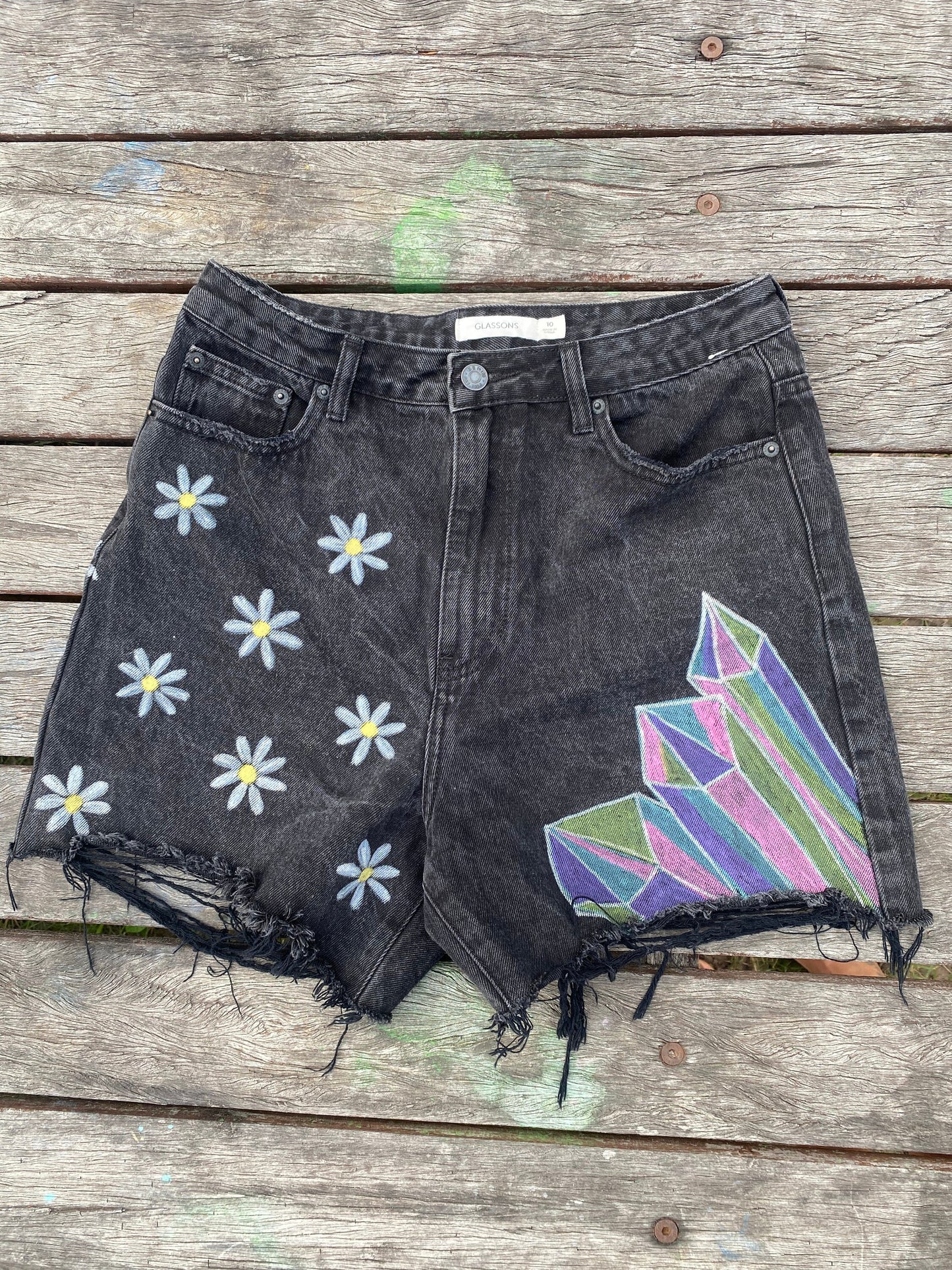 High waisted black denim shorts, flowers and crystals.